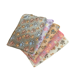 Thick flannel pet blankets with paw prints in grey, purple, beige, pink, and white colors