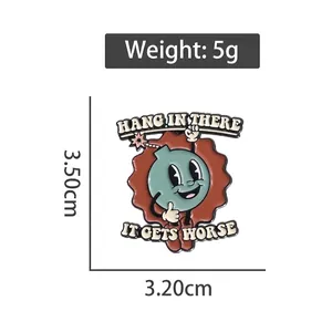 Cartoon bomb enamel pin badge with 'Hang in There' text on white background