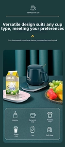 Detail of smart cup warmer pad with digital display and dark green ceramic lucky mug