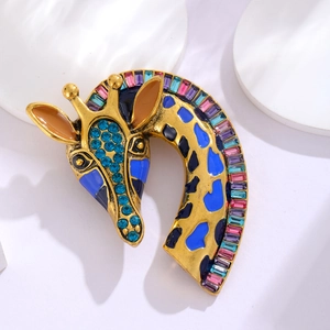 Vintage giraffe brooch with colorful rhinestones and blue enamel on a gold-tone base