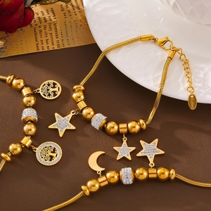 Gold star moon and tree of life charms on stainless steel bracelet jewelry set