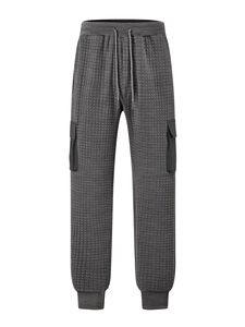 Detail of dark grey waffle texture fabric and side cargo pocket on men's jogger pants