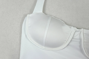 Detail of white halter dress with underwire cups and smooth micro-luster fabric