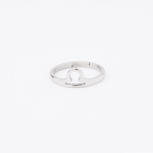 Detailed view of silver Libra zodiac sign ring in polished mirror finish stainless steel