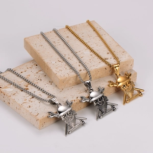 Vintage pirate skull necklaces in gold, silver, and black finish on stone props