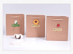 Three vintage kraft paper gift bags featuring artificial flowers and sincere greetings