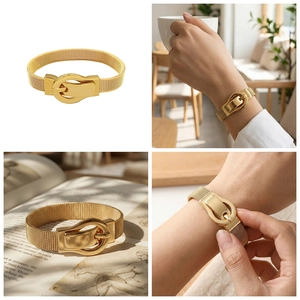 Detail of gold mesh woven bracelet featuring a luxury buckle clasp design for women