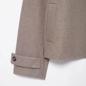 Short wool coat in taupe with stand collar featuring buttoned cuffs and side pockets