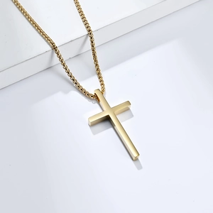 Polished gold stainless steel cross pendant necklace with box chain on white background