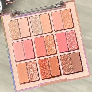 Detailed close-up of 18-color eyeshadow palette with matte and shimmer pink and coral tones