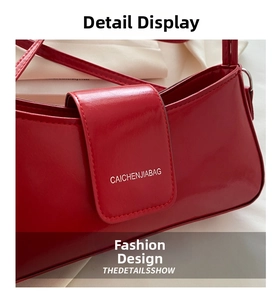 Close-up of a glossy red crescent bag with CAICHENJIABAG logo and neat stitching