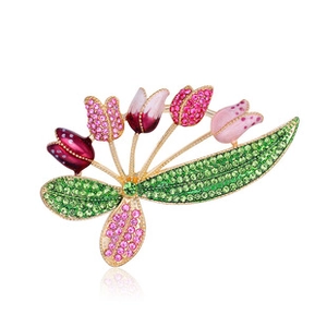 Macro view of crystal tulip brooch with pink enamel and sparkling rhinestones