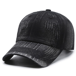 Vintage distressed black denim baseball cap with heavy ripped details and washed texture