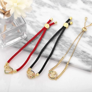 Close-up of adjustable Mama Love bracelets with colorful zircon heart and flower charms
