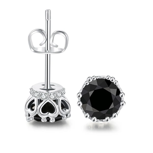 Detail of silver stud earrings with black zircon and hollow heart-shaped crown base