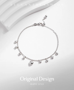 Detailed view of silver heart pendant bracelet with cubic zirconia and lobster clasp
