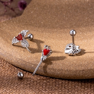 Gothic Halloween cartilage stud earrings set with red heart zircon and bat wing motifs
