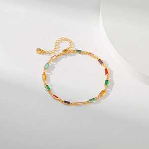 Detail of 18K gold-plated chain with colorful rectangular crystals and lobster clasp