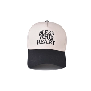 Detail of embroidered 'Bless Your Heart' text and lips on a two-tone baseball cap