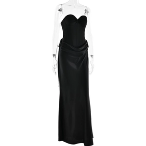 Detail of elegant black strapless evening gown with pleated waist and satin finish draping