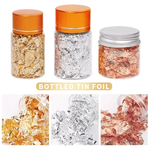 Three bottles of metallic gold, silver and copper foil flakes for DIY nail art and crafts