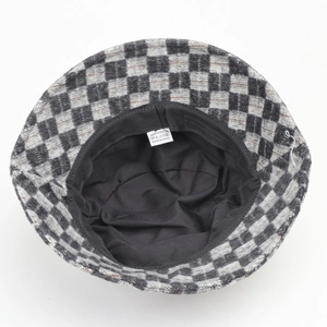 Classic black and white checkered wool bucket hat with soft lining and quality labels