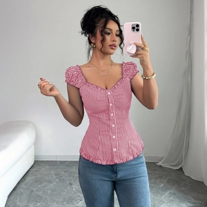 Detail of red and white striped square neck blouse with button trim and ruffle hem