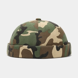 Detailed view of camouflage docker hat featuring durable canvas fabric and rolled brim edge