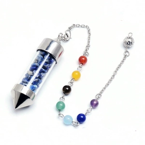 Detail of cone crystal pendulum with blue lapis chips and seven chakra beads on chain