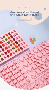 Detail view of pink silicone fruit and sea animal candy molds with gummy bears
