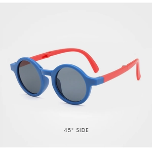 Detail view of foldable children's sunglasses with blue and red frame in 45-degree angle