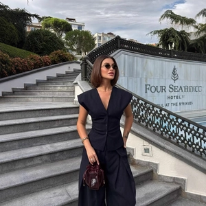 Women's dark blue pinstripe vest and wide-leg trousers suit set for business style