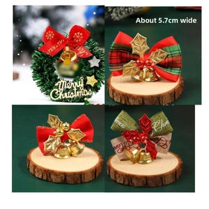 Macro view of Christmas wreath and bow bells with Merry Christmas text, 5.7cm width