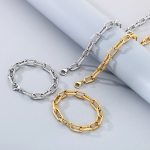 Close-up of hip-hop style screw buckle bracelets in gold and silver stainless steel