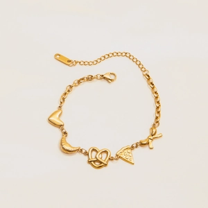 Macro view of 18K gold plated heart and croissant charms on the stainless steel bracelet