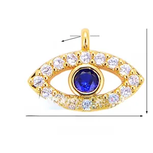 Detail of gold-plated evil eye pendant with blue zircon and white crystal pave setting