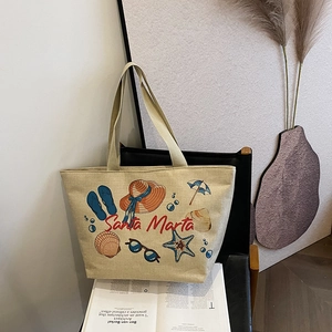 Detail of Santa Marta beach print on large beige linen tote bag with natural textures