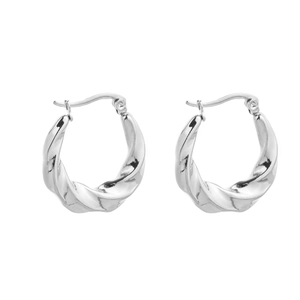 Detail of silver twisted rope hoop earrings showing the spiral texture and U-shaped clasp