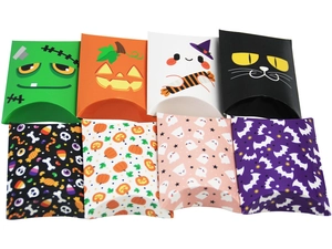 Detail view of assorted Halloween pillow treat boxes with pumpkin and ghost patterns