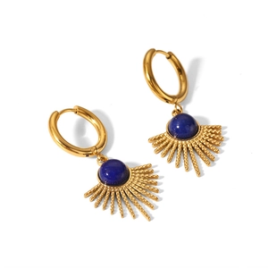 Detailed macro view of golden sunflower earrings with blue lapis lazuli stones