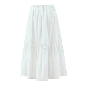Close-up of white bohemian skirt featuring high waist elastic and layered lace stitching