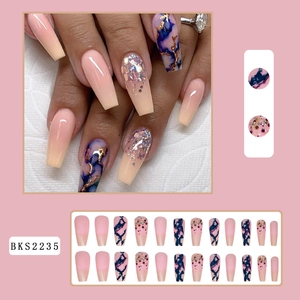 Detail of pink gradient and blue marble press-on nails with glitter in coffin shape
