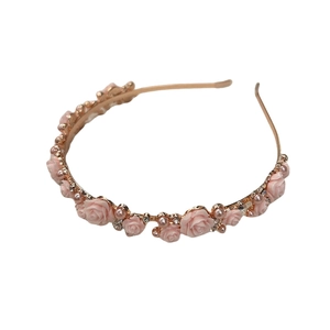 Pink rose headband with faux pearls and rhinestones on a rose gold metal frame