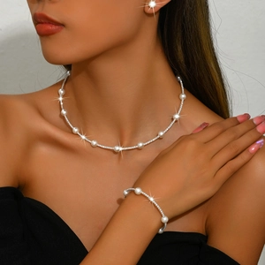 Elegant pearl and rhinestone choker necklace with matching bracelet set for women