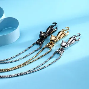 Cute stretching cat necklaces in black, gold and silver finishes on a blue background