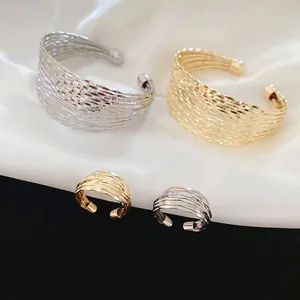 Multi-layer woven metal cuff bracelet and ring set in polished gold and silver finishes