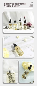 Detail of 60ml essential oil glass bottles with dried flowers and black dropper lids