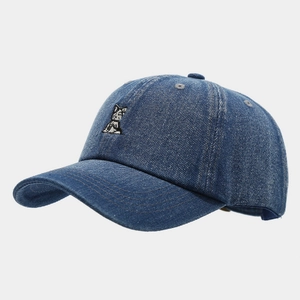 Detailed embroidery of a cartoon puppy on navy blue washed denim baseball cap