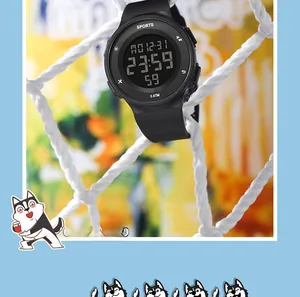 Digital sports watch on a white mesh net showing 5 ATM water resistance detail