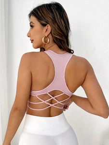 Pink sports bra with multi-strap criss-cross back design and shockproof fit for yoga